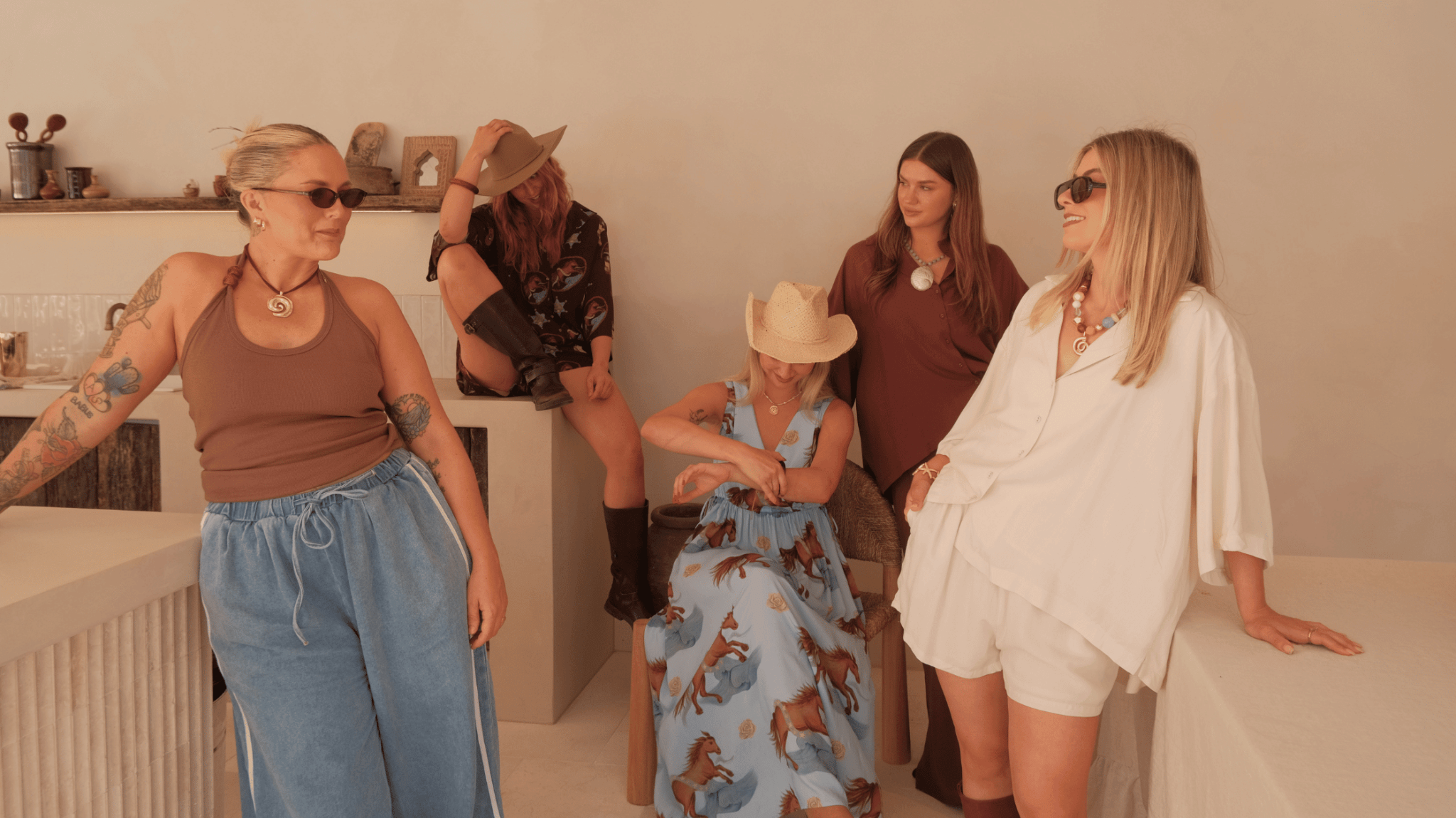 Women in blue and brown printed outfits