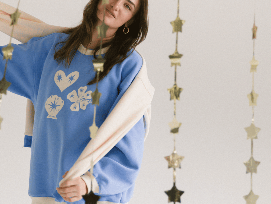 Models wearing The Lullaby Club Essentials Sets and Slouchy Jumpers in cream and cobalt blue. Featuring cozy winter loungewear with breastfeeding-friendly zips and relaxed fits. Designed for modern mums and everyday ease.