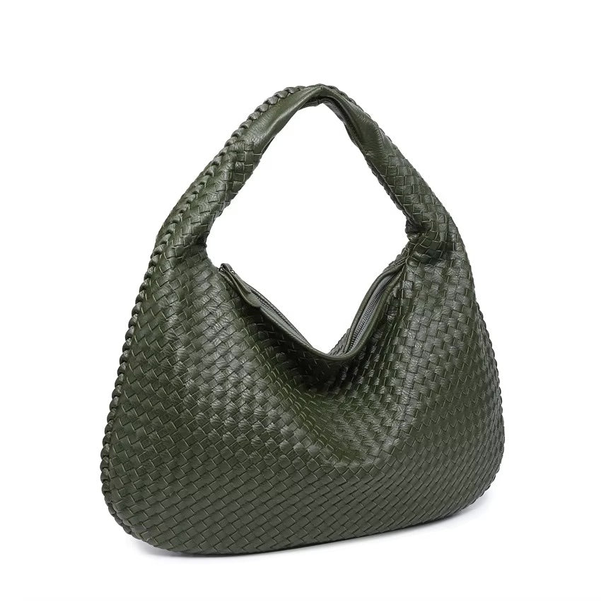 Green woven handbag on a white background