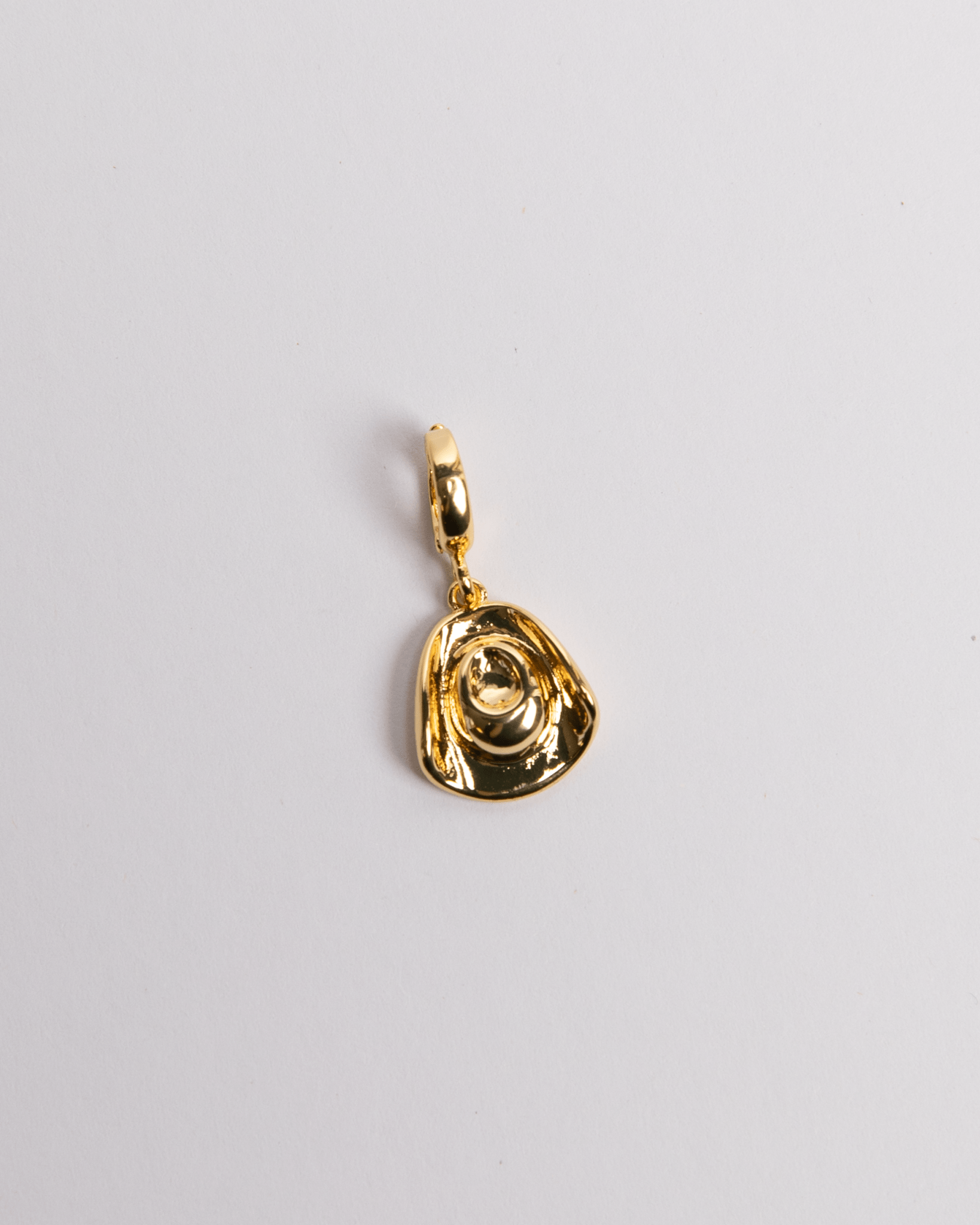 A gold-plated cowgirl hat charm with a loop clasp on a white background.