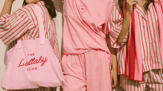 Three women wearing pink and red outfits