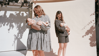 mothers wearing emerald green lounge set and black gingham avalon smock dress on cream backdrop with their children