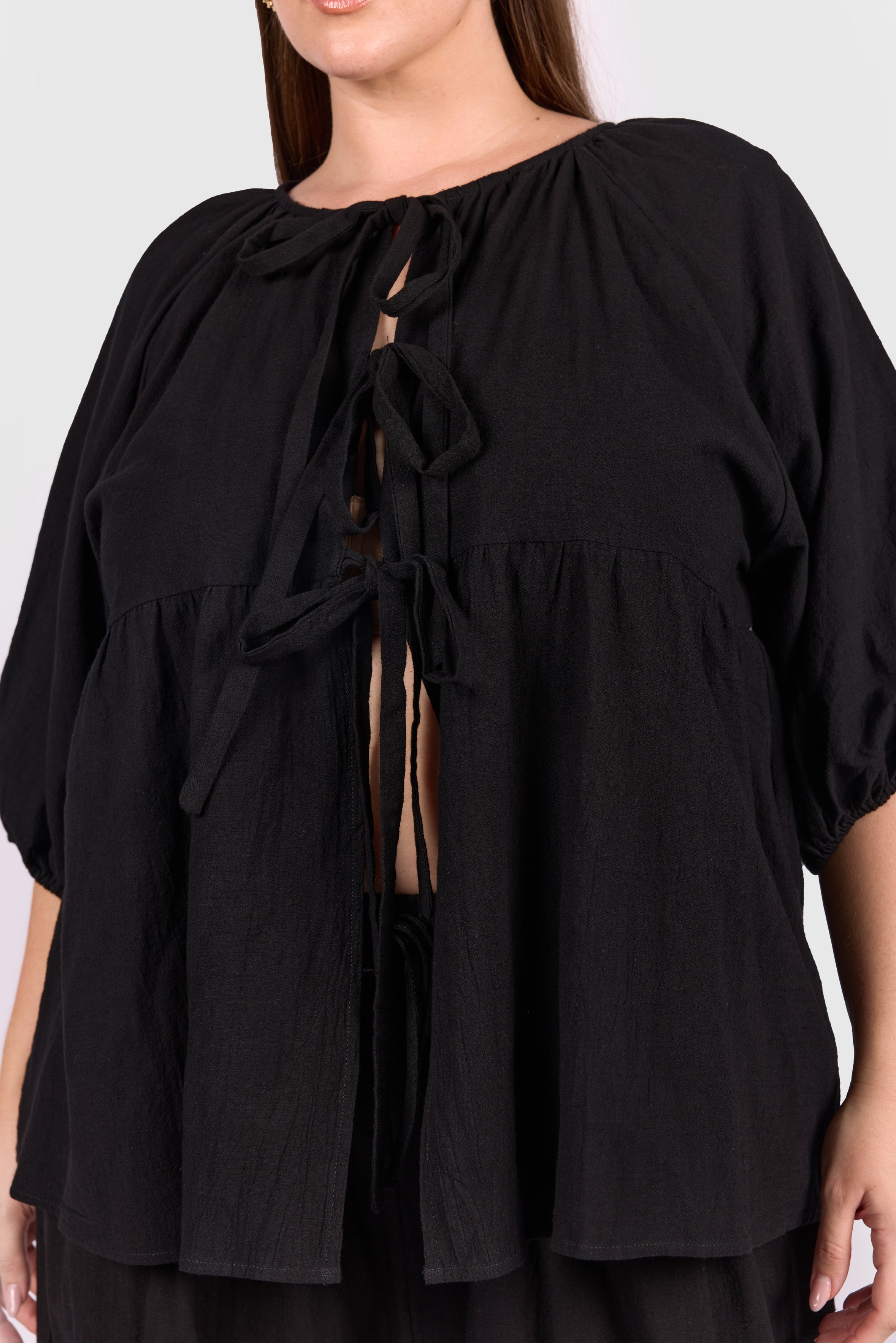 Close up of front ties of black florence top available in sizes AU 6-26