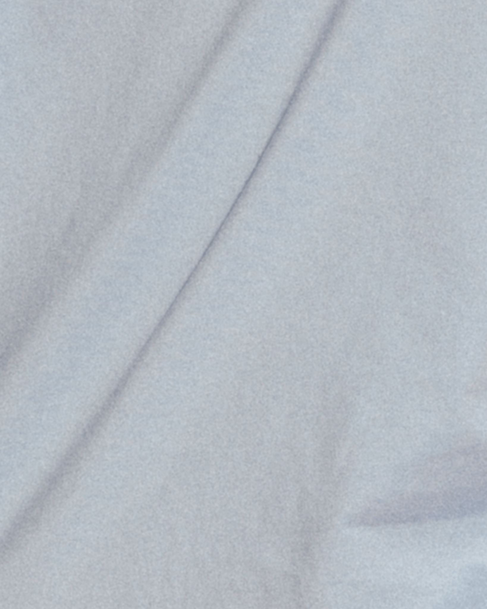 Close-up of light blue fabric. 