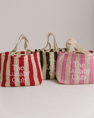 3 holiday style tote bags made from woven material in different coloured striped patterns. 